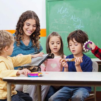 Teacher working with students
